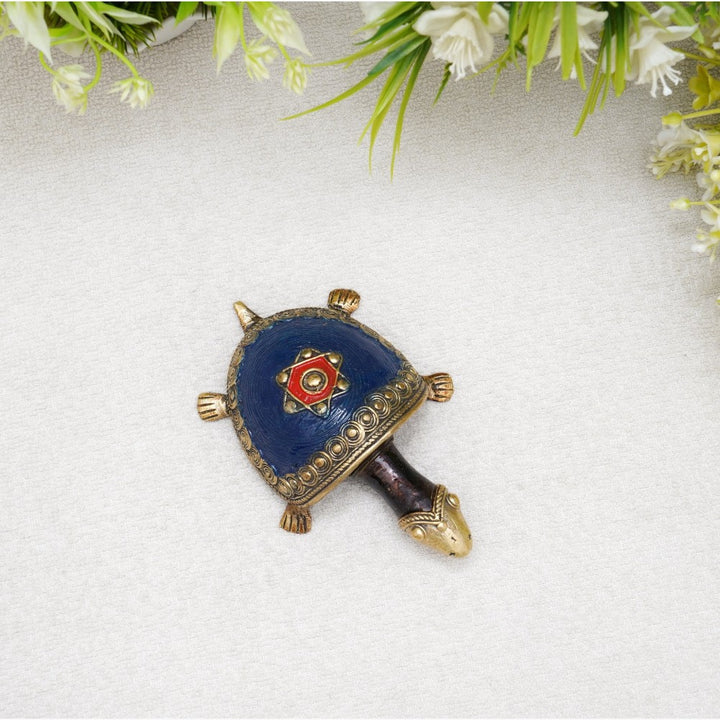Top view of handcrafted Dhokra bell metal coin tortoise figurine in blue finish showcasing coin motif and circular shell texture