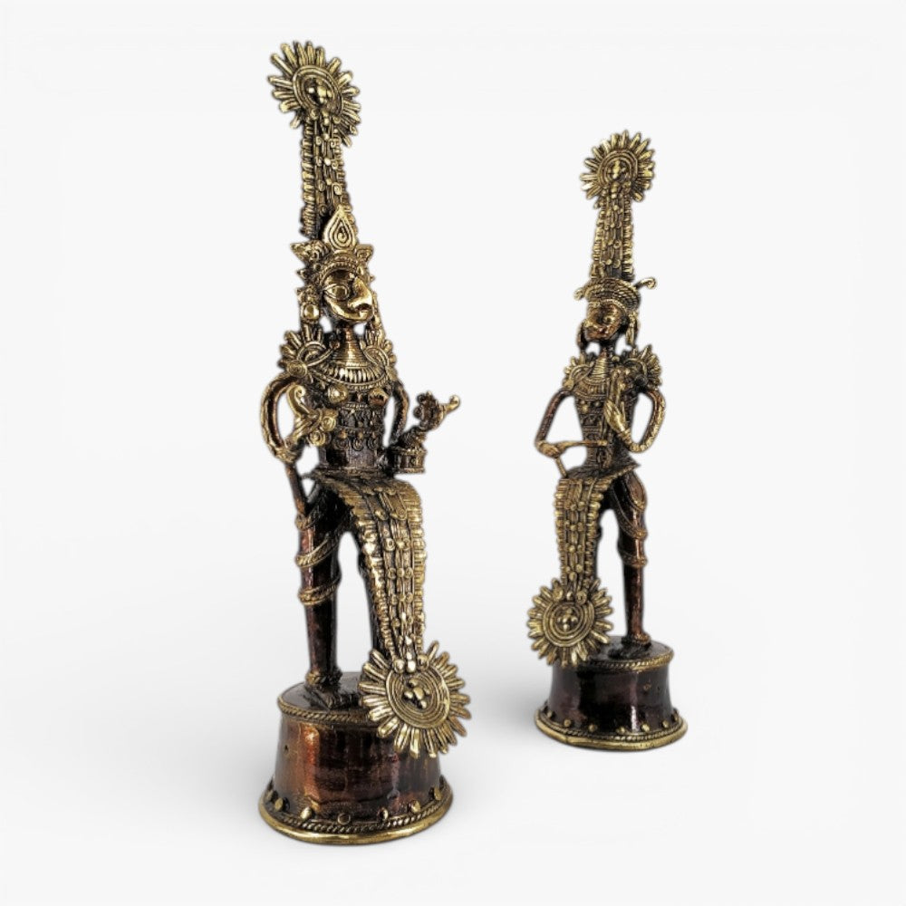 Angled view of Jhitku Mitki brass tribal couple statue highlighting musical instruments and intricate Bastar Dhokra craftsmanship
