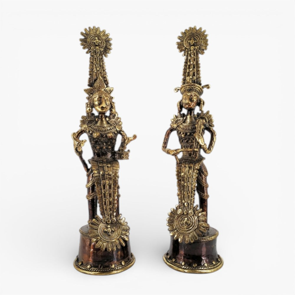 Front view of handmade Jhitku Mitki brass tribal statue pair in antique bronze finish showcasing traditional Dhokra art detailing