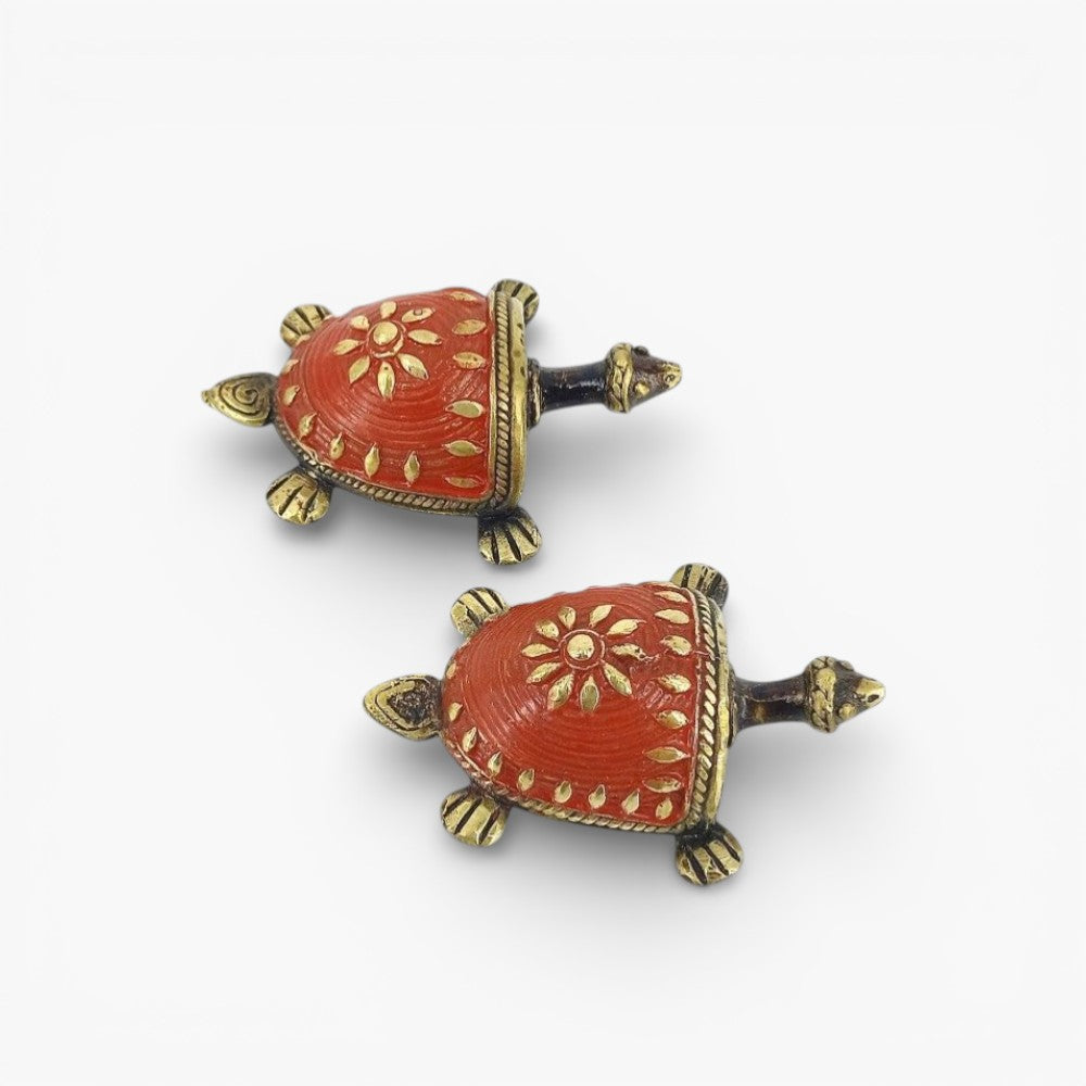 Red enamel brass tortoise figurine close-up detailing