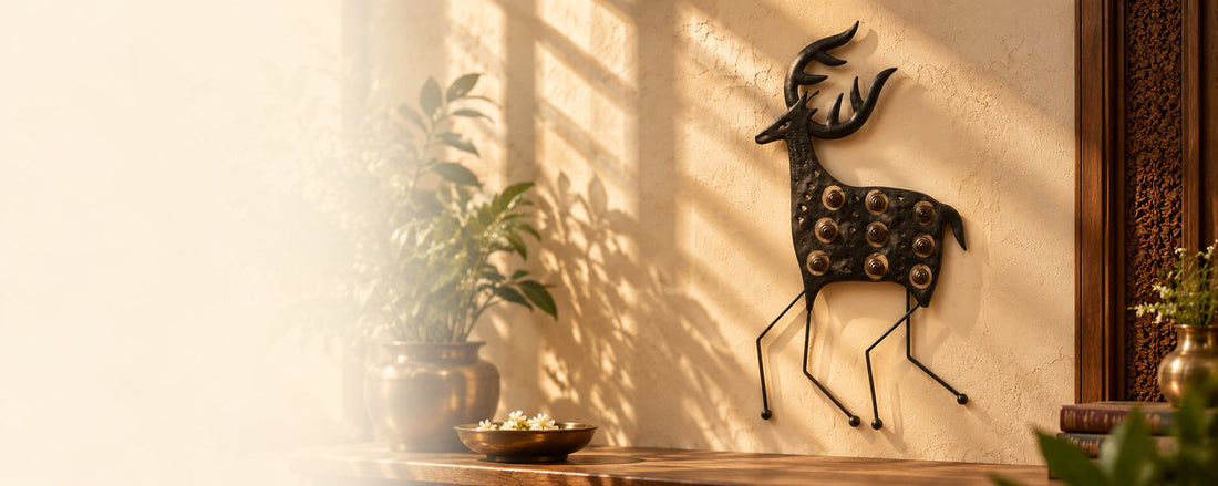 Bastar wrought-iron deer wall hanging on a sunlit wall
