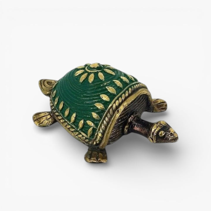 Handcrafted brass tortoise showpiece green close-up texture