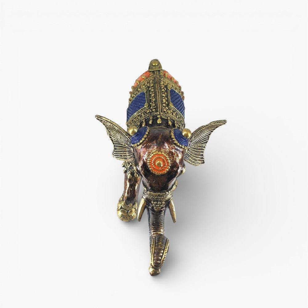 Top angle view of brass soccer playing elephant statue showing hand-painted blue and orange saddle work