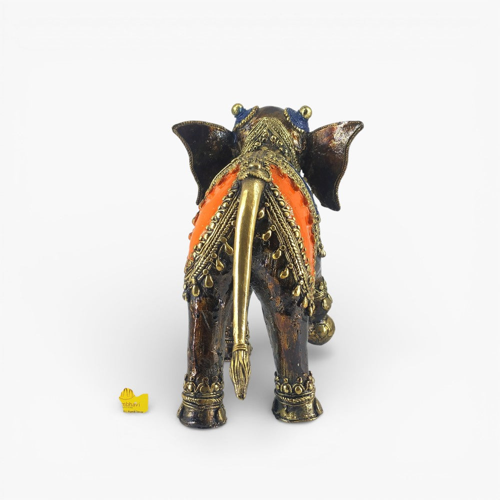 Back view of handcrafted bronze elephant statue with dhokra art saddle and tail detailing