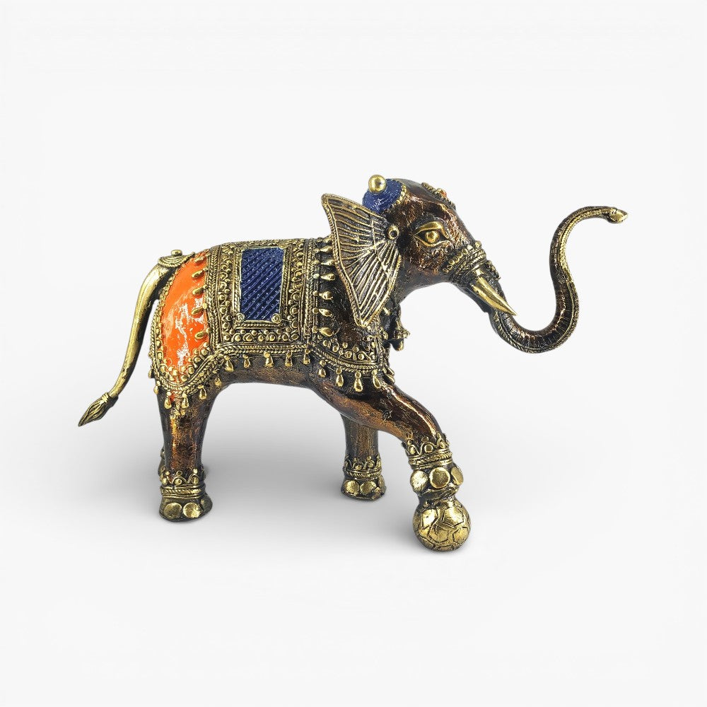 Side profile of handcrafted brass soccer elephant statue highlighting dhokra metal texture and decorative saddle