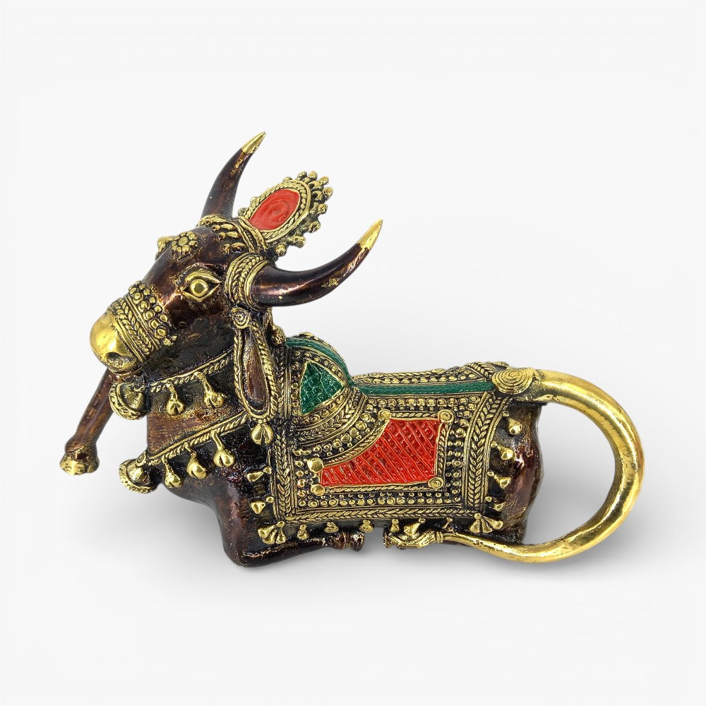 Close-up of brass Nandi sculpture with red green detailing