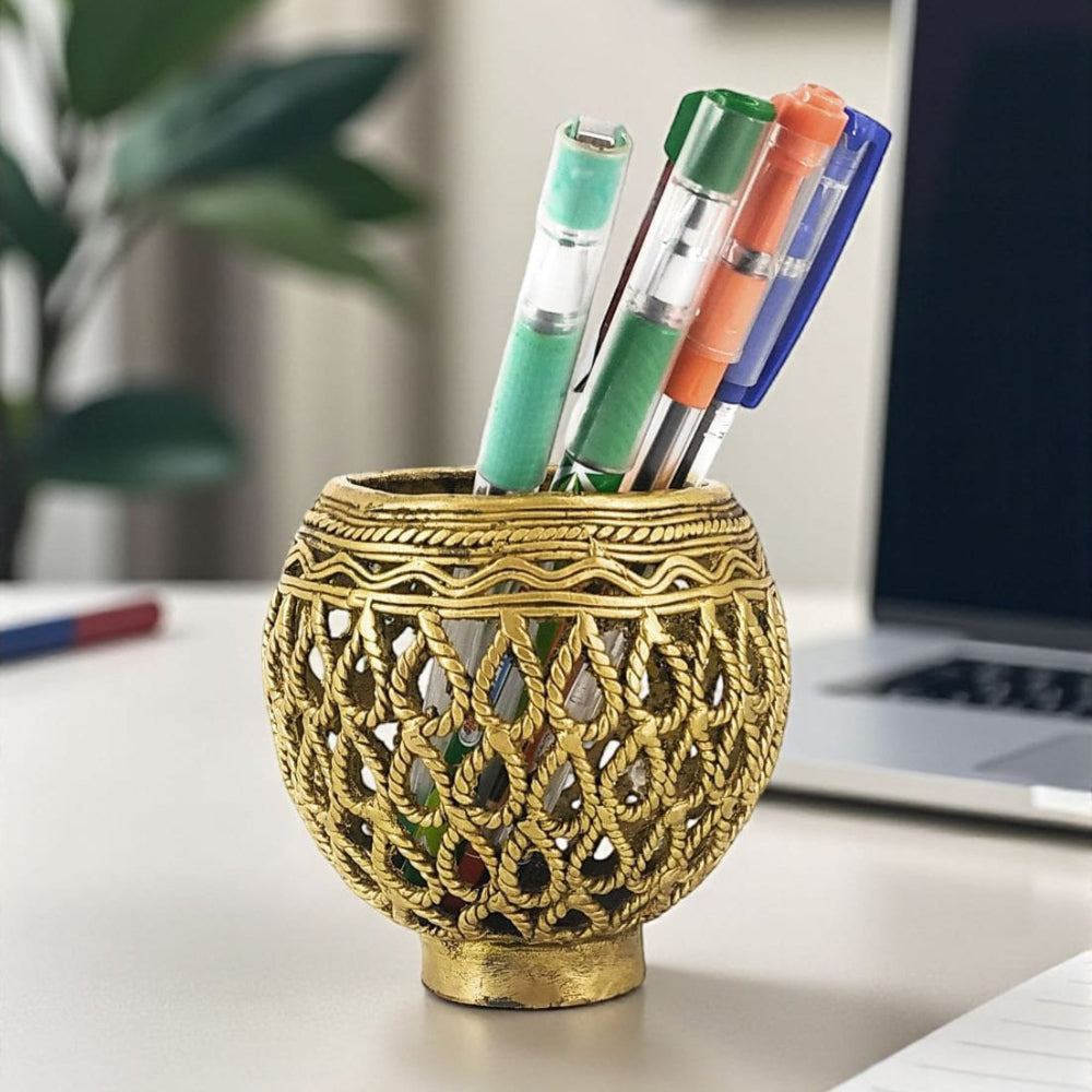 Lifestyle Front view of ornate brass pen holder in bulbous shape showcasing traditional Dhokra jali craftsmanship