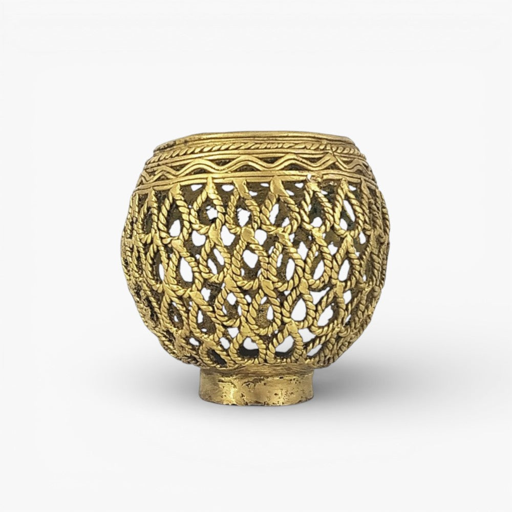 Studio front view of Dhokra art brass ornate pen holder with waterdrop inspired bulbous form