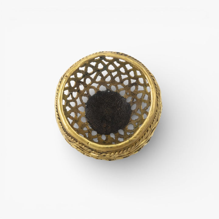 Top view of handcrafted brass bulbous pen holder highlighting open jali design and smooth inner base