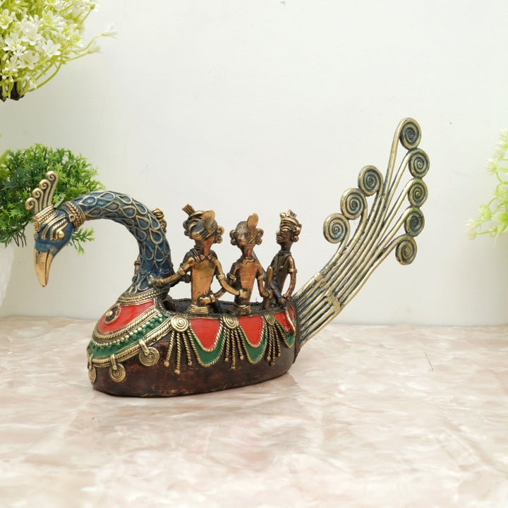 Handmade Bastar art brass peacock boat statue in multicolor finish displayed in a lifestyle setting highlighting traditional dhokra craftsmanship