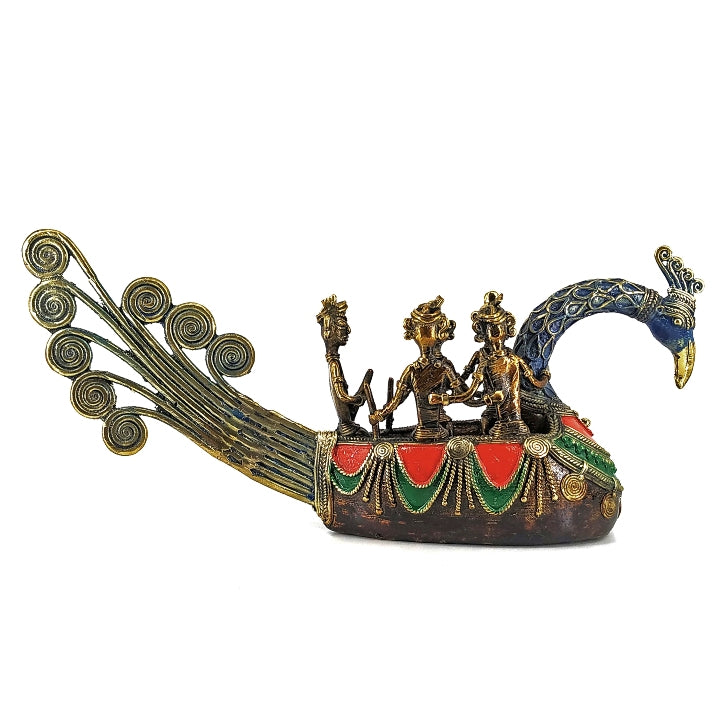 Bastar art brass peacock boat statue with multicolor detailing shown in side profile showcasing fishermen figures and peacock form
