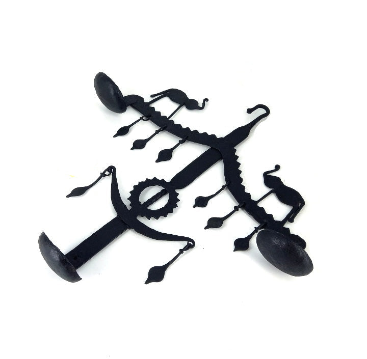 Top view flat lay of handmade Bastar iron elephant design wall hanging showing diya holders and hanging details