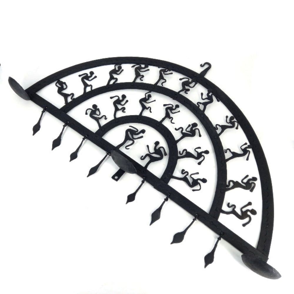 Handmade Bastar iron art half circle wall hanging with multiple curved layers displayed in a studio shot, showcasing folk dan