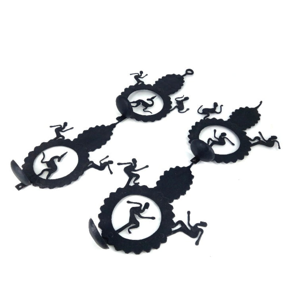 Handcrafted Bastar iron art leaf design tea light wall hanging units shown in an angled studio view, highlighting detachable candle holders, dancer silhouettes, and matte black iron texture       