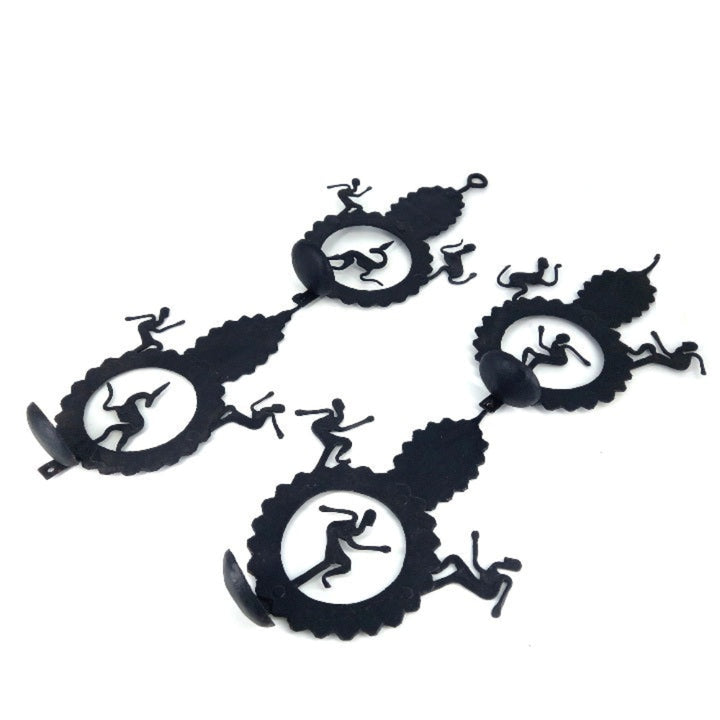 Handcrafted Bastar iron art leaf design tea light wall hanging units shown in an angled studio view, highlighting detachable candle holders, dancer silhouettes, and matte black iron texture       