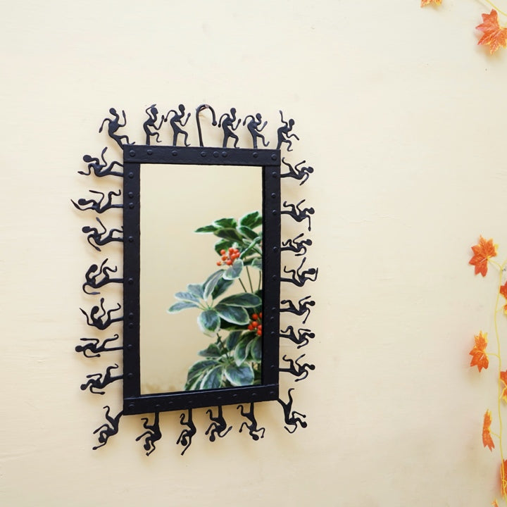 Rectangular handcrafted Bastar iron art wall mirror shown from the front, highlighting hand-forged iron frame with traditional folk motifs and polished glass surface