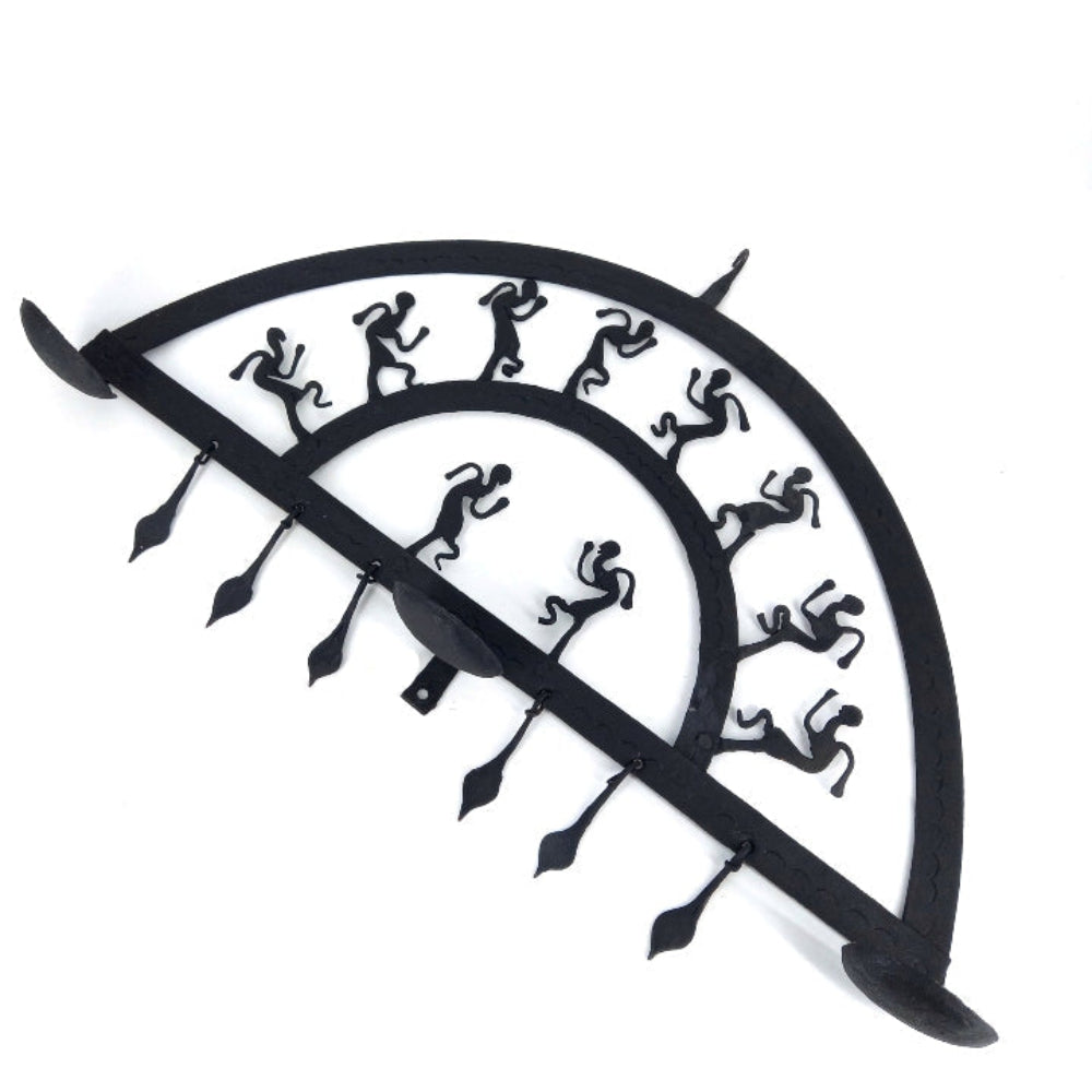 Bastar iron craft half circle wall hanging shown in a studio setup, focusing on layered arc design, handcrafted iron figures, and traditional metal detailing