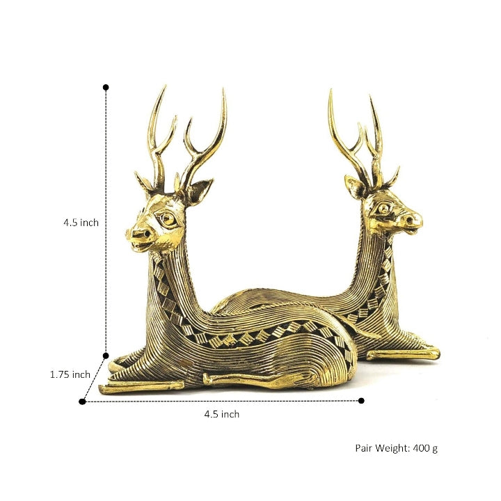 Rear angled view of handcrafted brass sitting deer figurines highlighting detailed antlers and striped body pattern