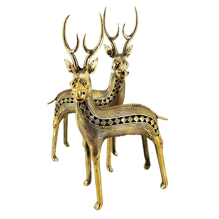 Angled studio view of handcrafted brass deer standing pair showcasing detailed antlers and body texture