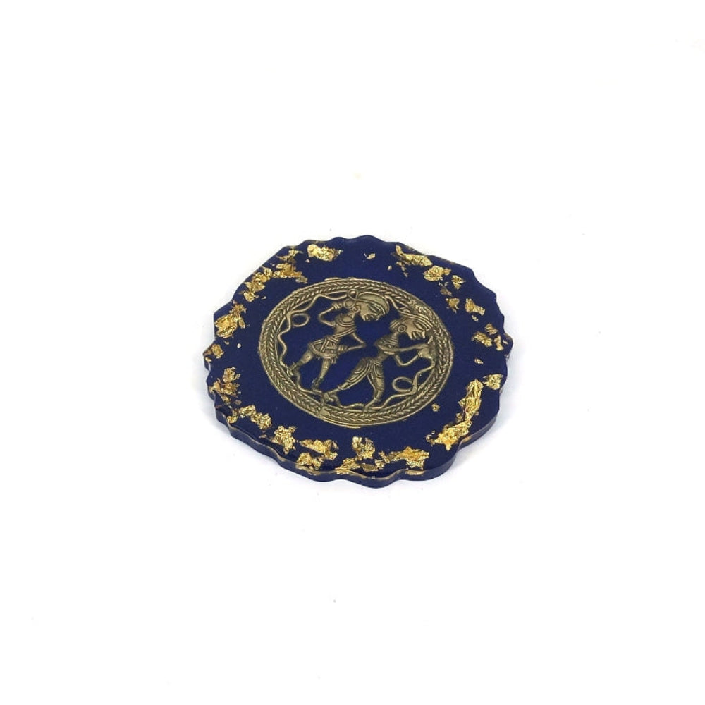 Close-up of brass motif on resin coaster