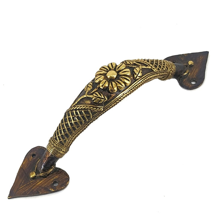Handcrafted brass door handle with flower and lattice design in bronze finish showing intricate decorative metalwork