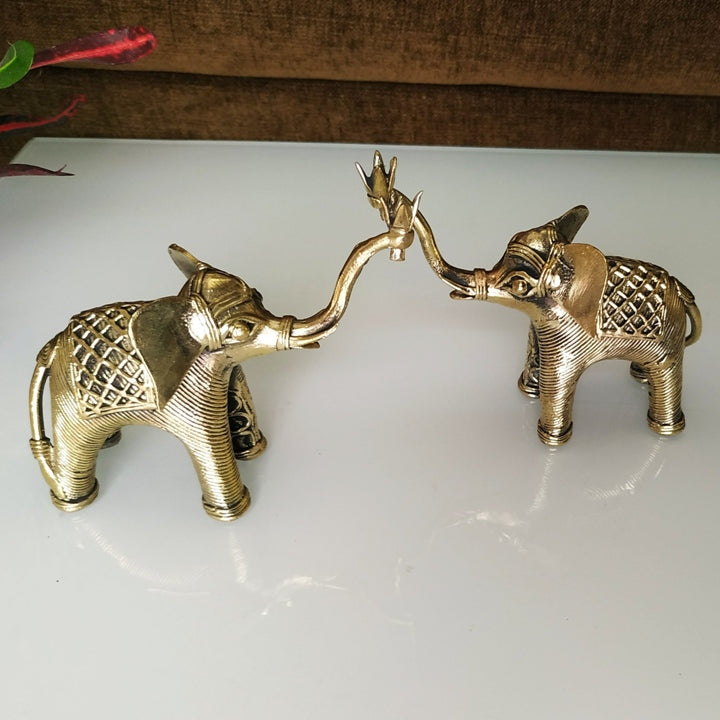 Brass elephant duo with raised trunks placed on table, elegant handmade dhokra art home decor