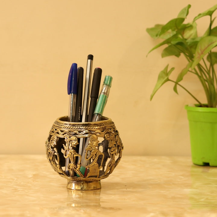 Handcrafted Dhokra art brass pen holder with marching musicians design used as an elegant desk organizer
