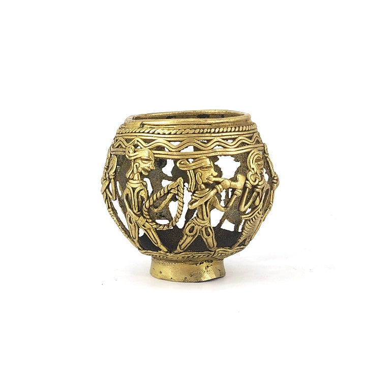 Studio front view of handcrafted brass pen holder showcasing Dhokra art marching musicians all around