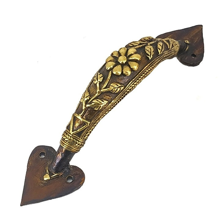Handcrafted Dhokra bell metal door handle with flower and leaf design in bronze finish showing ornate curved detailing