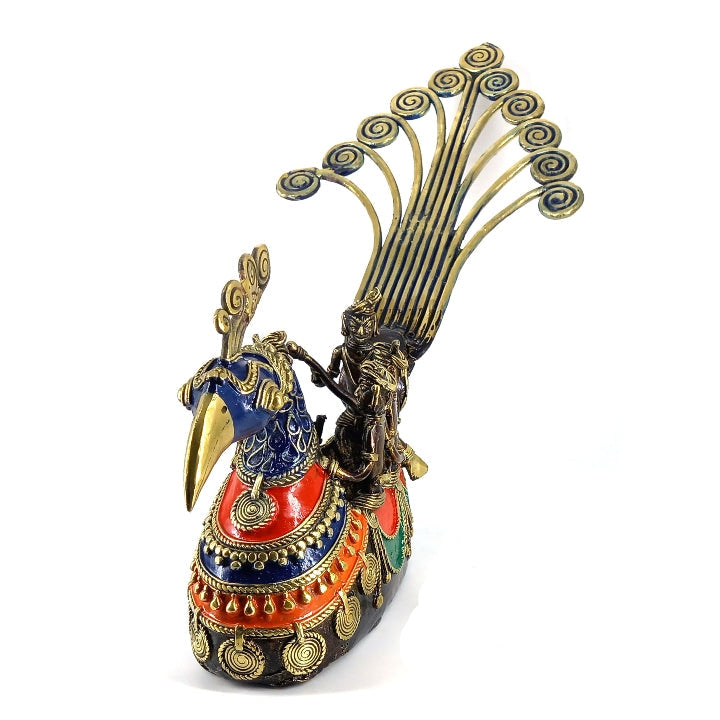 Front angled view of handcrafted brass Dhokra peacock boat statue emphasizing peacock head detailing and traditional metal patterns