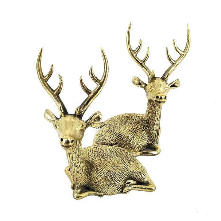 Handcrafted brass deer pair with antlers resting pose front view