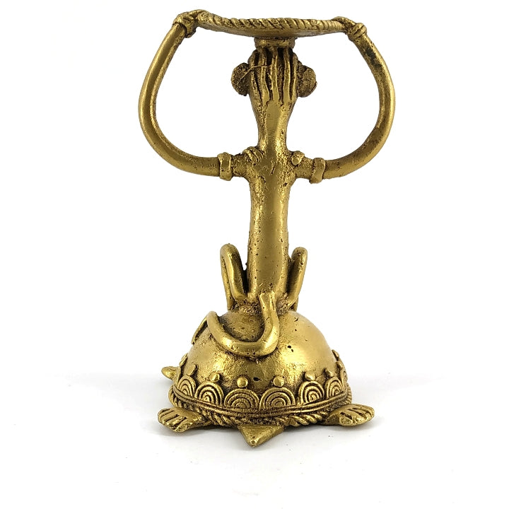 Back view of handcrafted brass candle holder décor