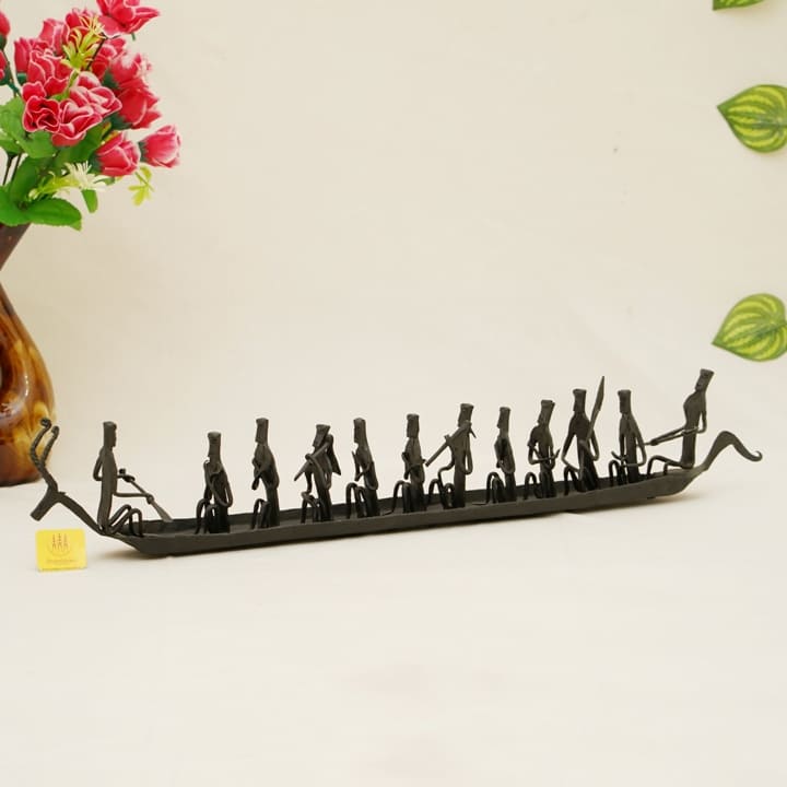Handmade Bastar iron art deer Kerala boat tabletop showpiece in black finish displayed in a lifestyle setting for home and of