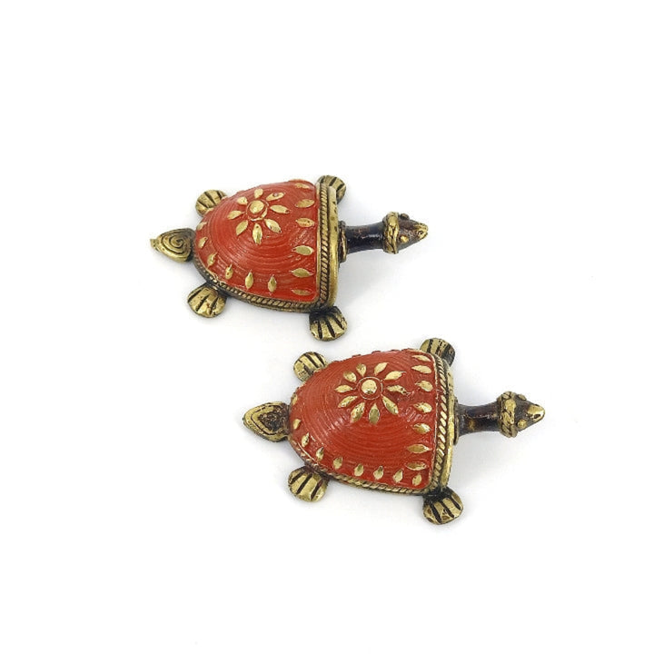 Red enamel brass tortoise figurine close-up detailing