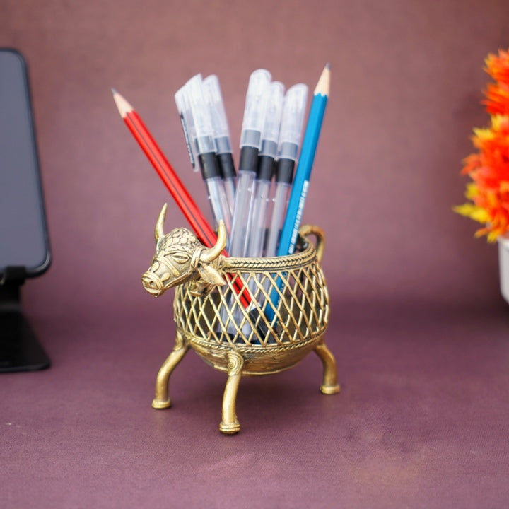 Bell metal Bastar Dokra art cow pen holder on office desk