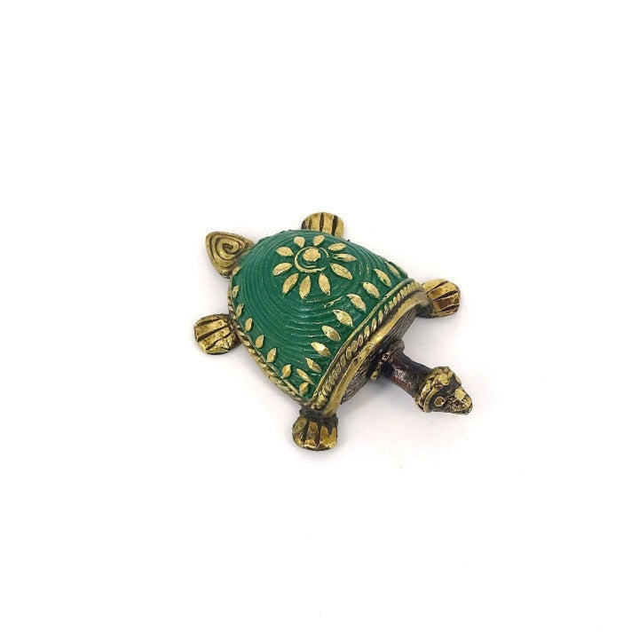 Handcrafted brass tortoise showpiece green close-up texture