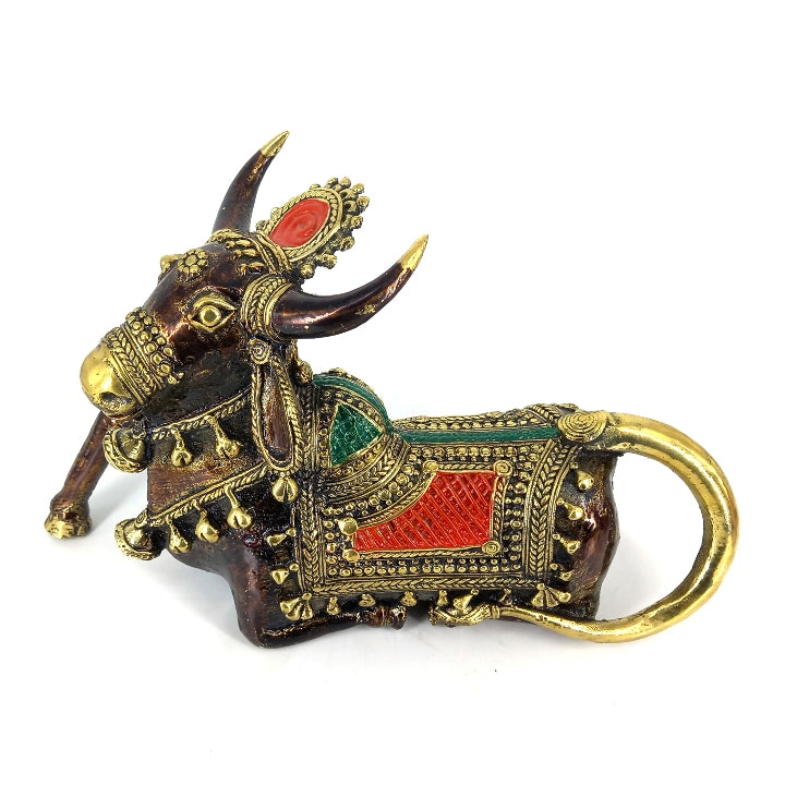Close-up of brass Nandi sculpture with red green detailing