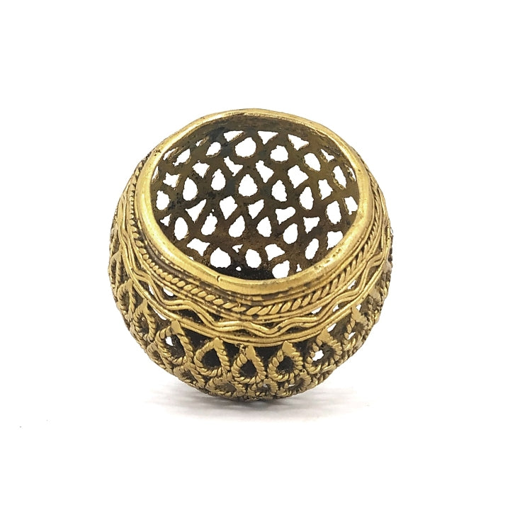 Angled top view of handcrafted brass bulbous pen holder showcasing intricate Dhokra lattice pattern